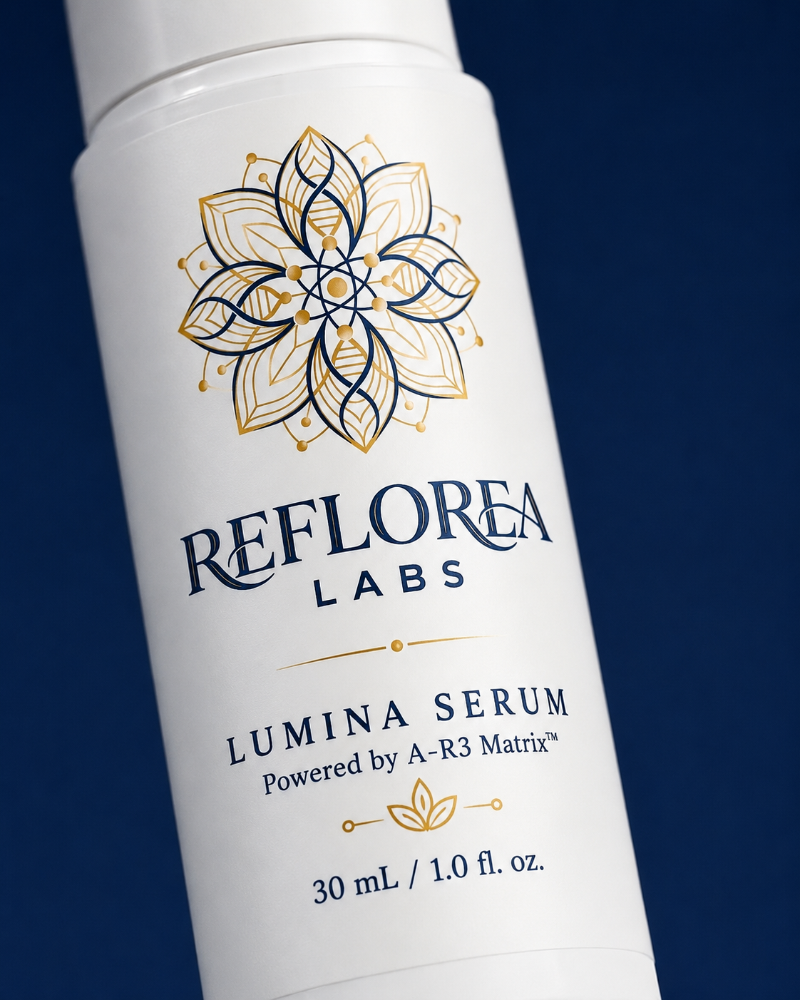Close detail of the Reflorea Labs Lumina Serum navy and gold label