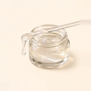 Palmitoyl tetrapeptide-7: a clear liquid on a glass rod over a small jar