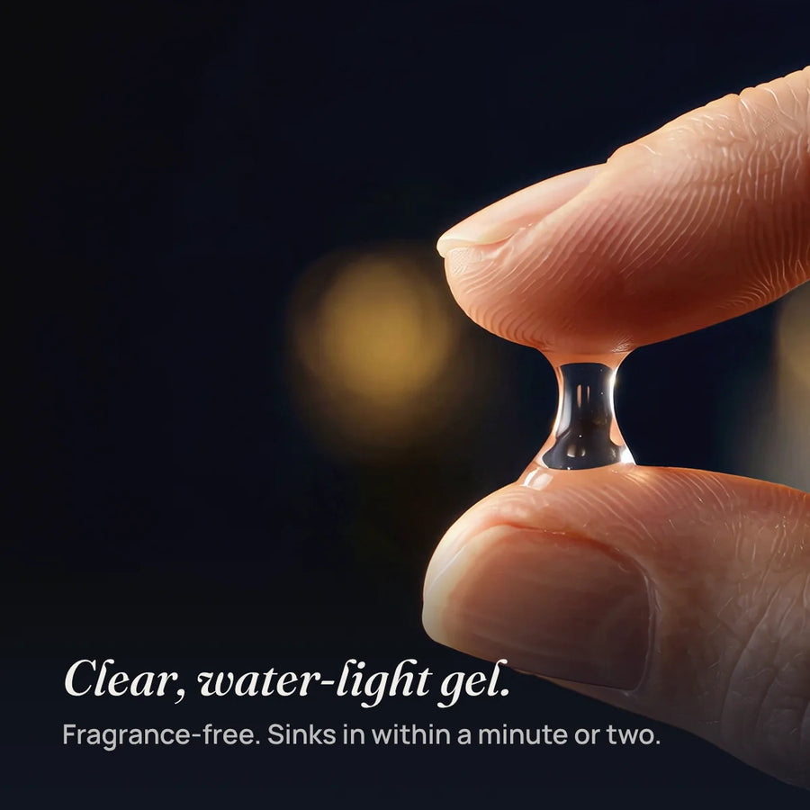 Lumina’s clear, water-light gel between two fingertips