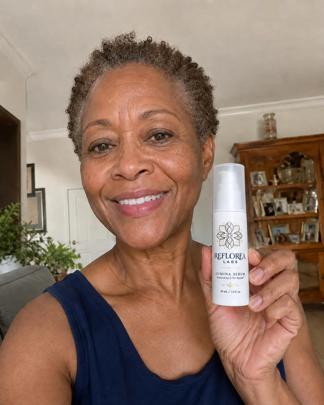 Woman holding the Lumina Serum bottle